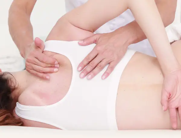 Woman Receiving Back Massage from Massage Therapist